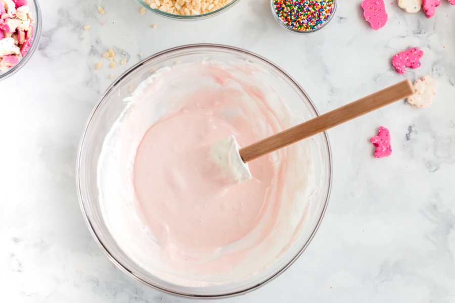 pink melted marshmallows and butter in mixing bowl