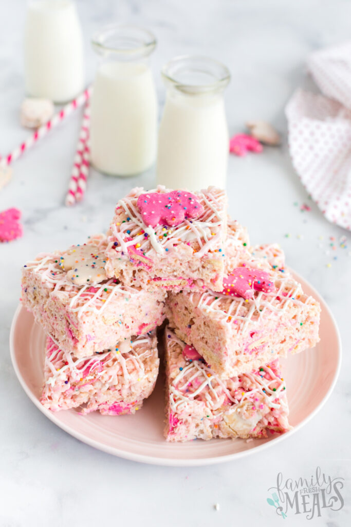 Circus Animal Cookie Rice Krispie Treats stacked on a white plate