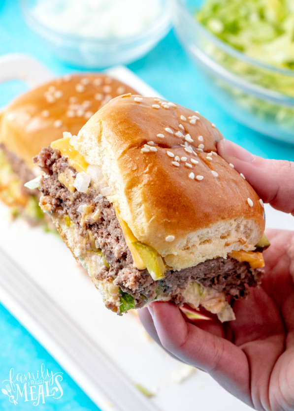 Big Mac Sliders - Hand holding a slider - Family Fresh Meals Recipe