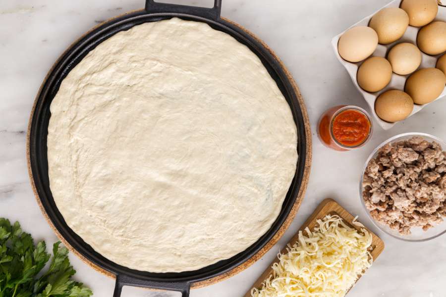 dough rolled out on baking pan