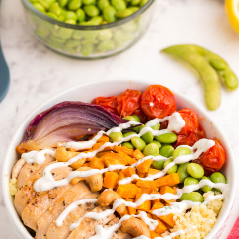 Chicken Buddha Bowl drizzled with a white sauce