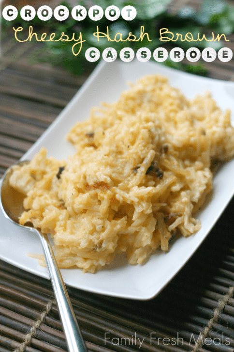 Cheesy Hash Brown Casserole served on a white plate with serving spoon