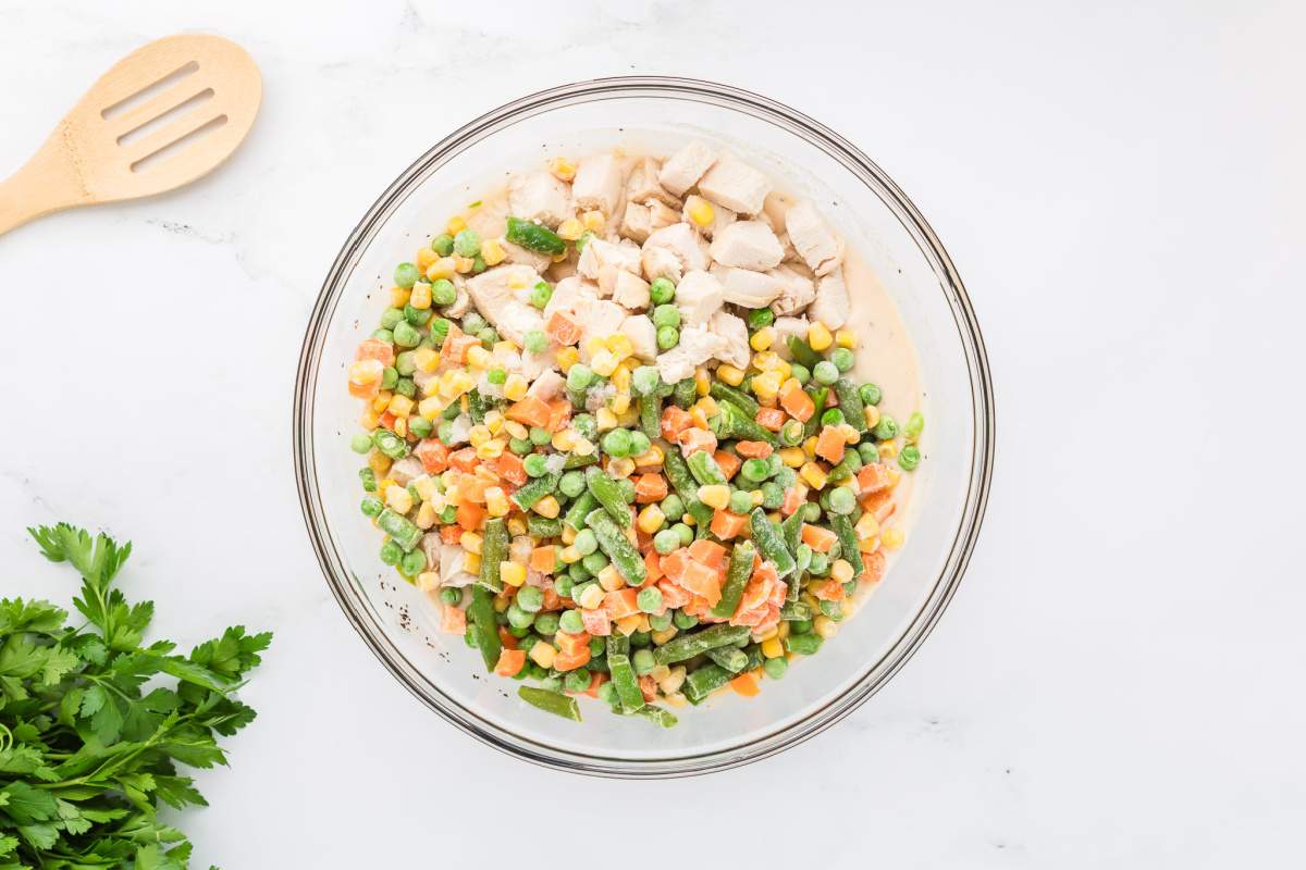 chicken and veggies added to bowl