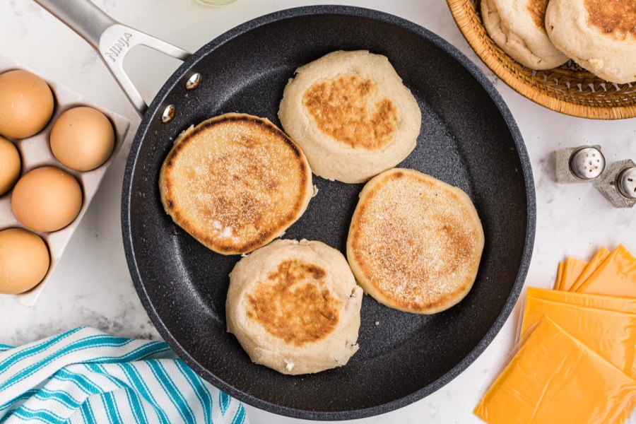 4 english muffins in a pan