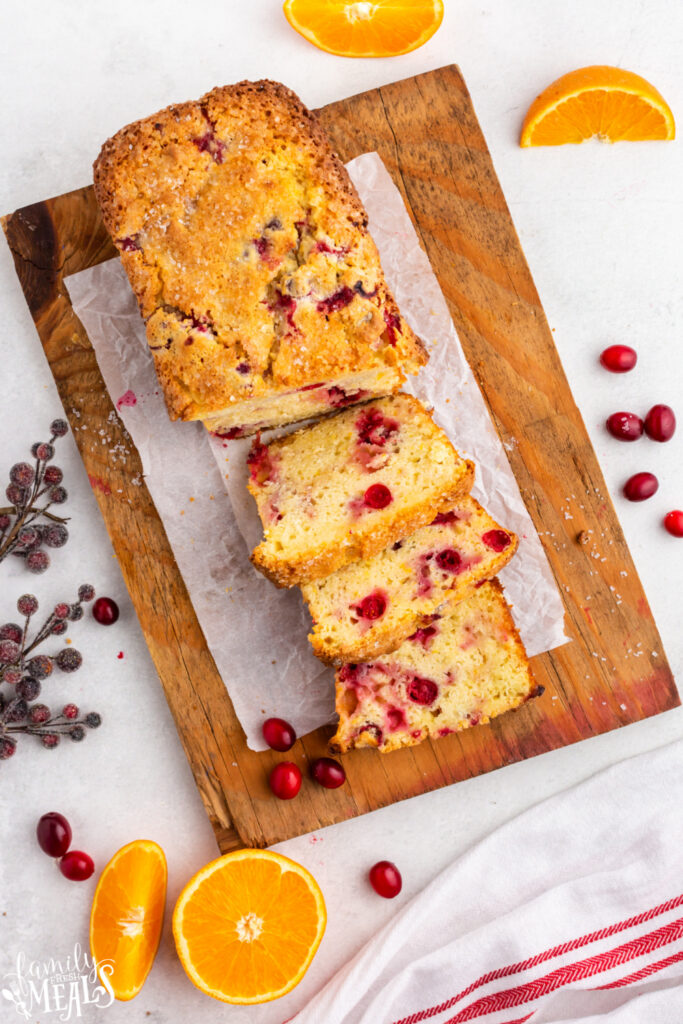 Cranberry Orange Bread cut into slices on cutting board