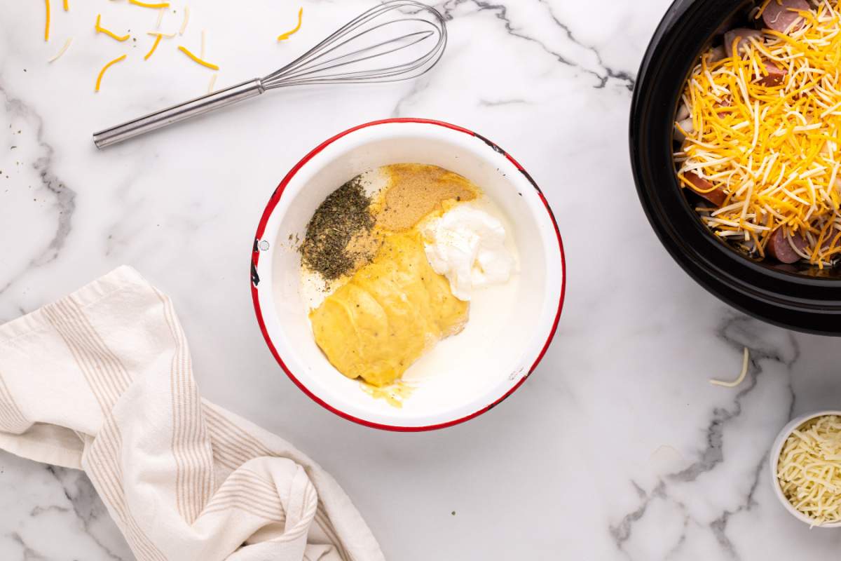 cream of chicken and herbs, sour cream, heavy cream, Italian seasoning, garlic powder, salt, and pepper in a bowl