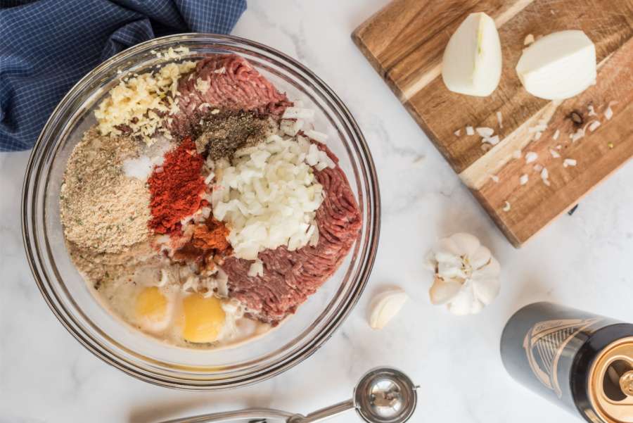 ingredients for meatballs in mixing bowl