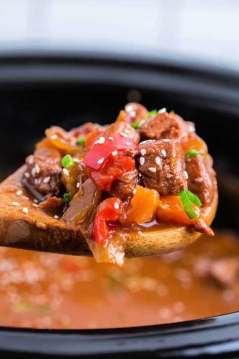 spoon scooping up some Crockpot Sweet and Sour Pork