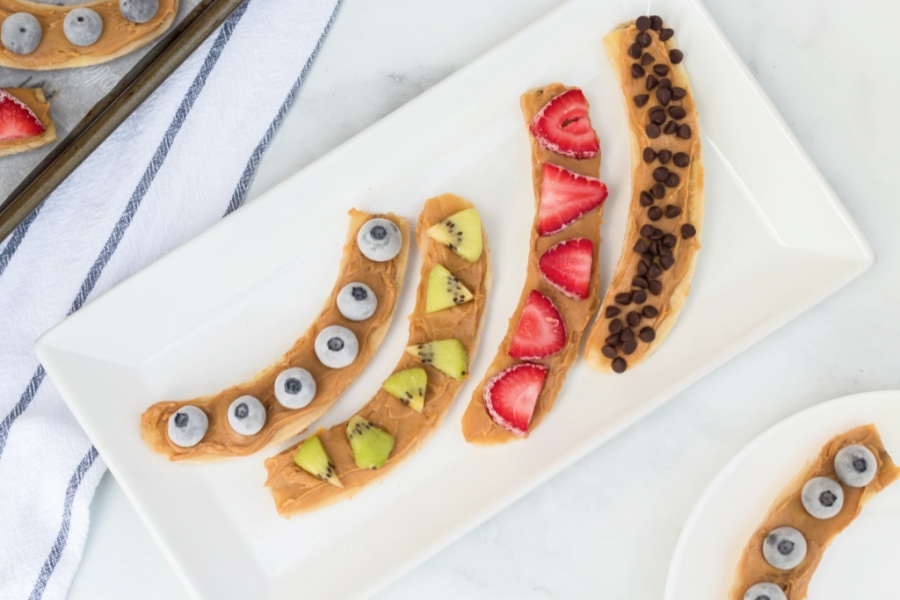 four frozen bananas on a white plate