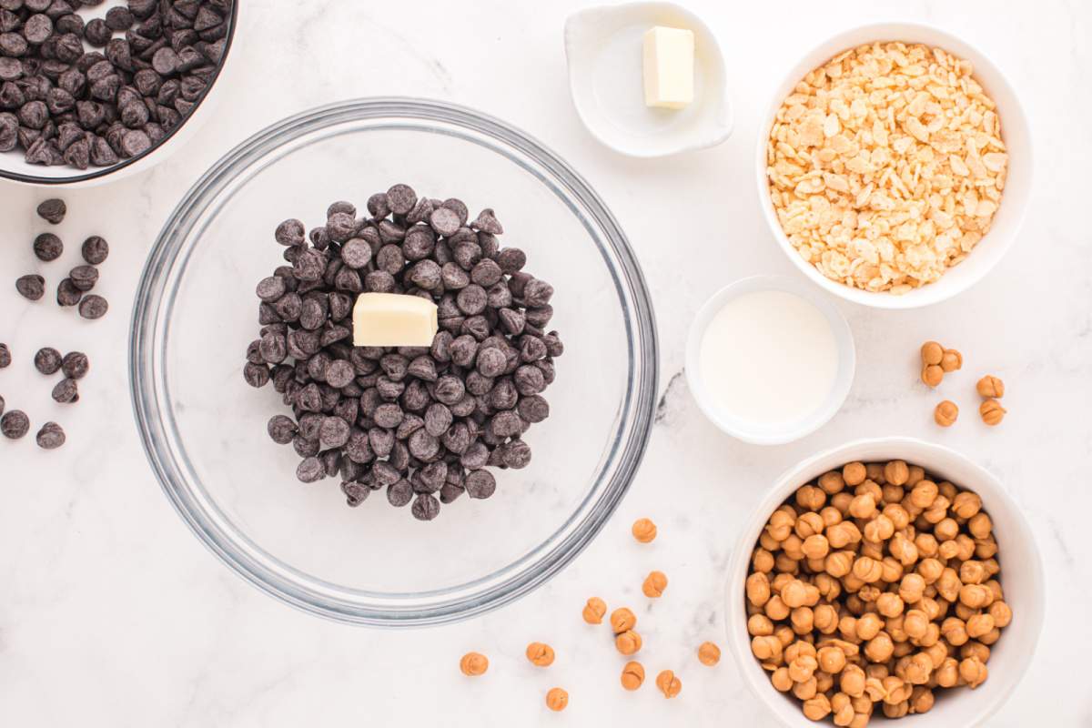 chocolate chips and butter in a bowl, rice cereal and caramel bits in a bowl