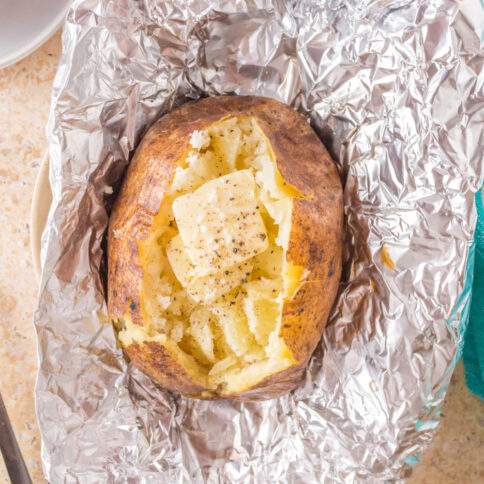 Grilled baked potato in foil