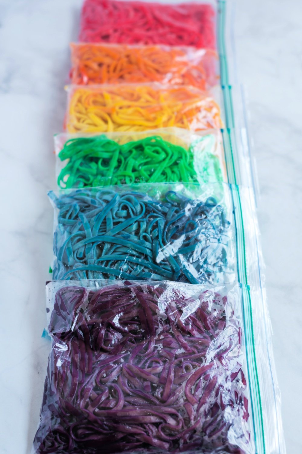 These colorful Rainbow Pasta Noodles turn any pasta dish into a real work of art. Even plain old spaghetti becomes magical! via @familyfresh