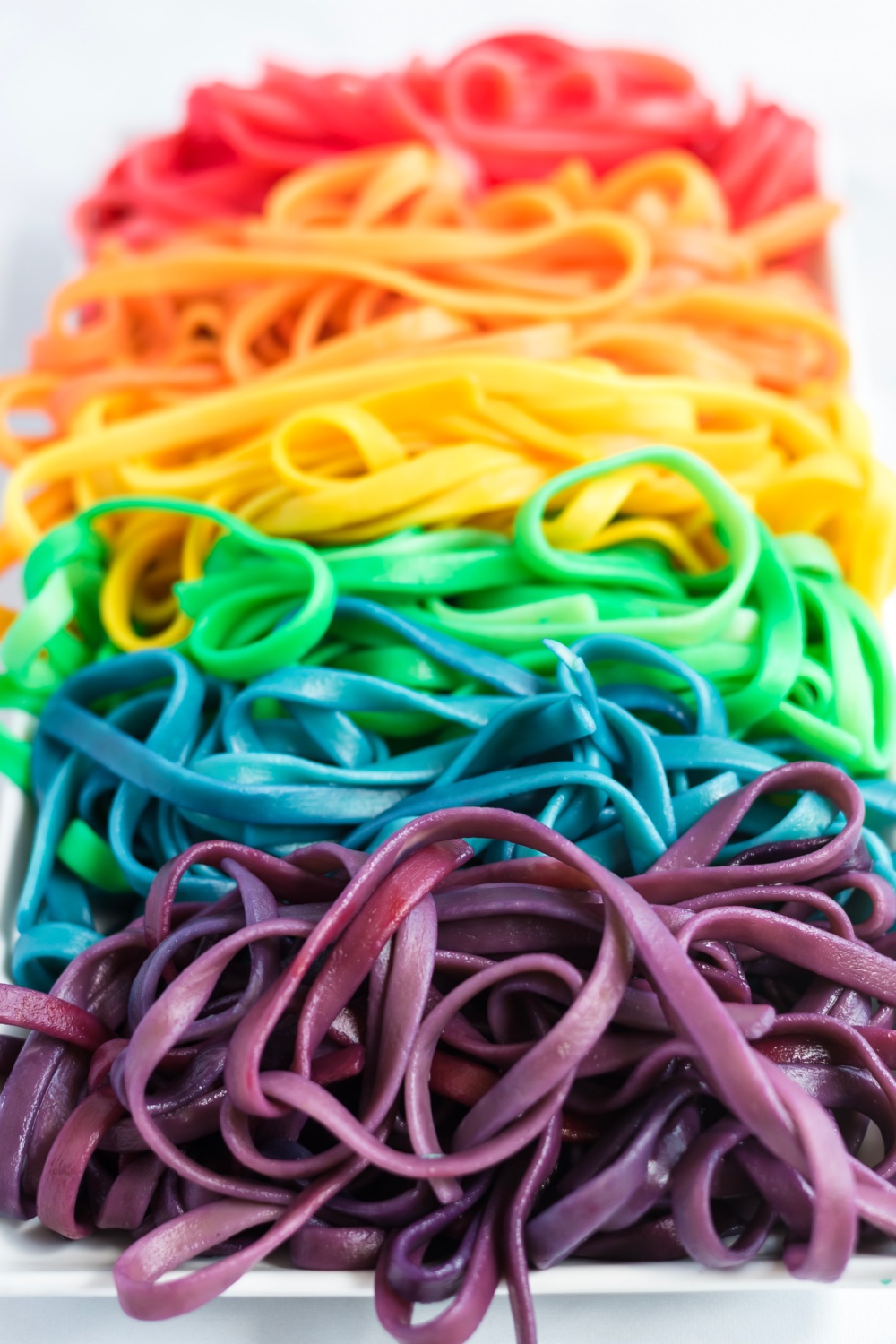 These colorful Rainbow Pasta Noodles turn any pasta dish into a real work of art. Even plain old spaghetti becomes magical! via @familyfresh