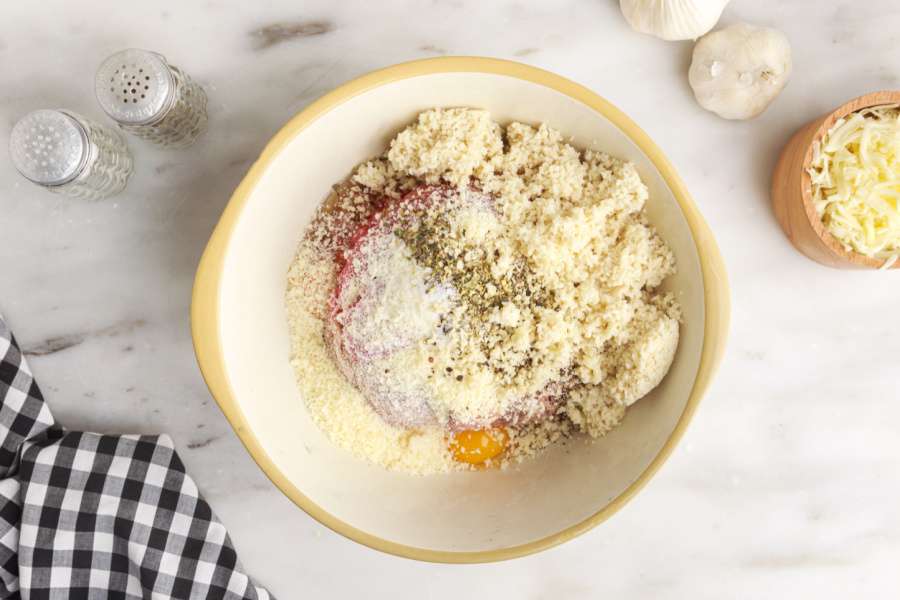 ingredients for meatball in mixing bowl