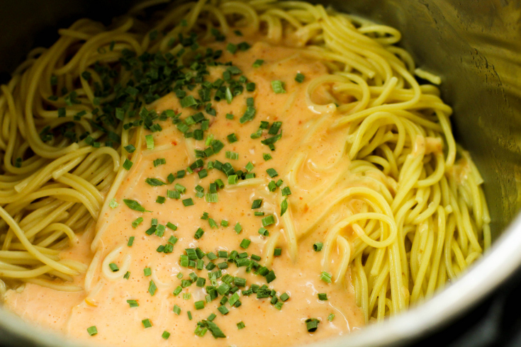 Instant Pot Bang Bang Shrimp Pasta - sauce and green onions added to instant pot