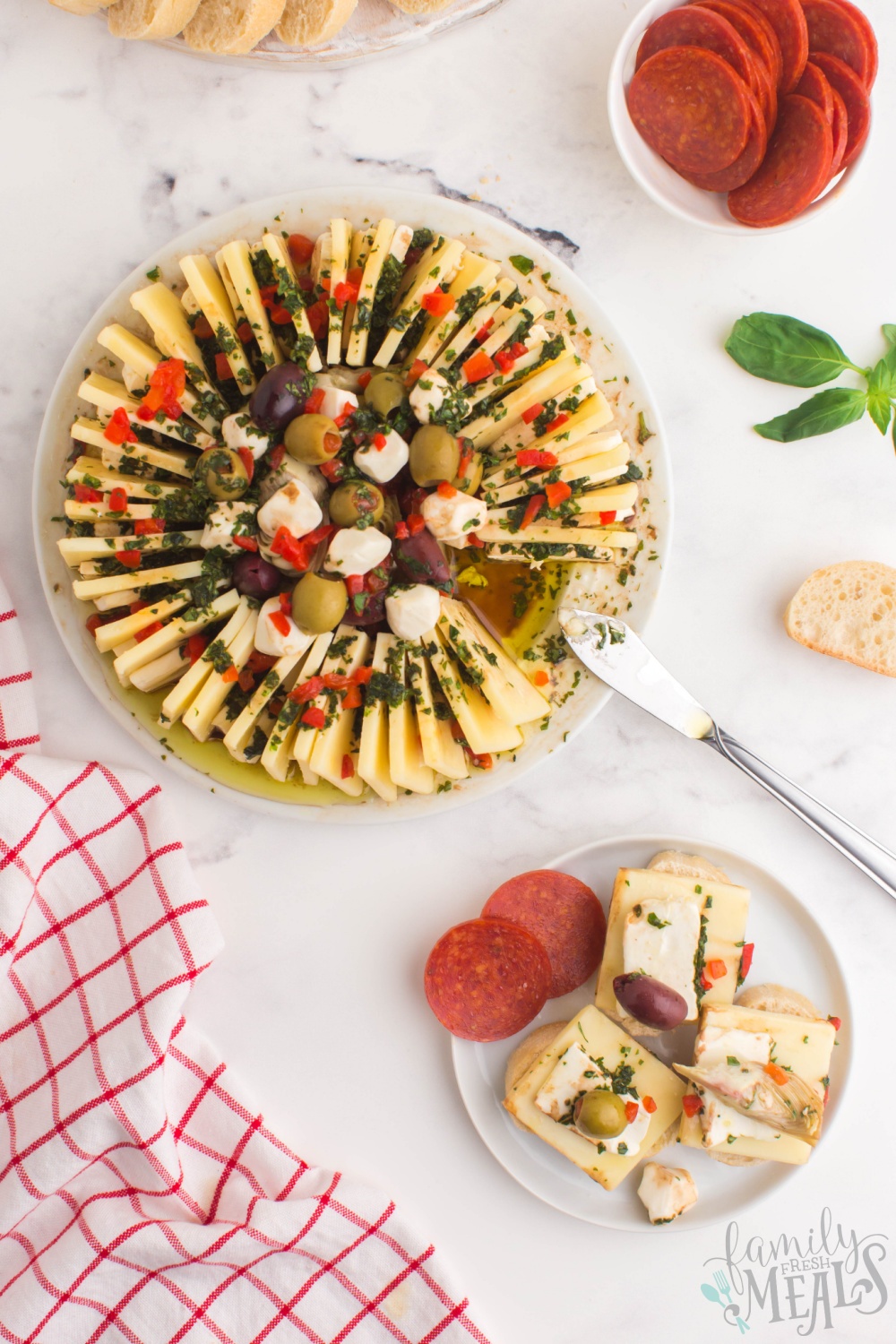 This marinated cheese ring is such an easy and fun way to add a bit of decorative snacking to your holiday appetizer table! via @familyfresh