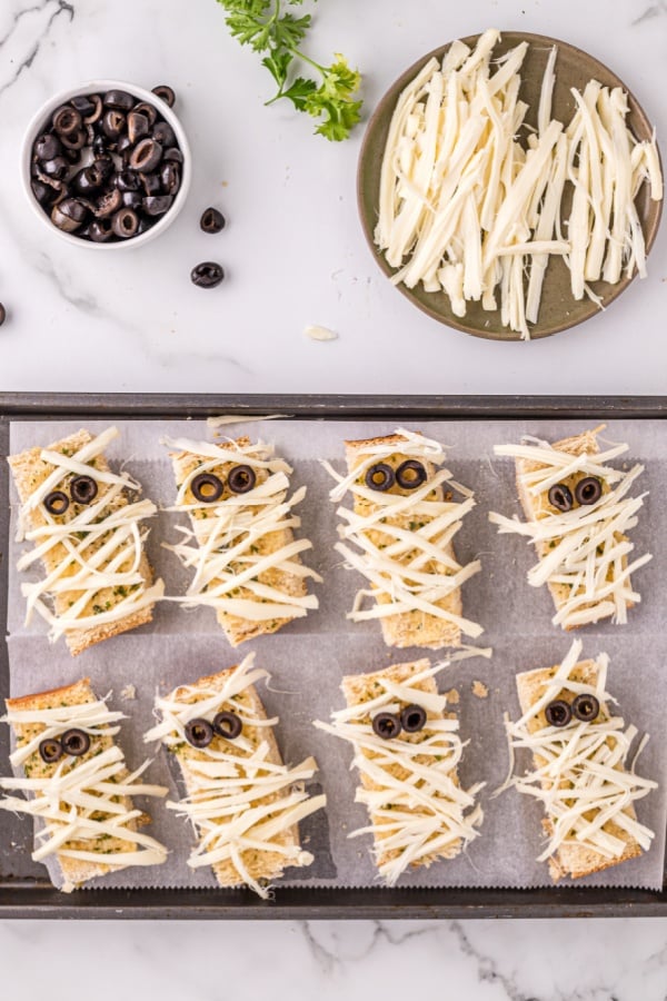 mummy garlic bread on baking pan