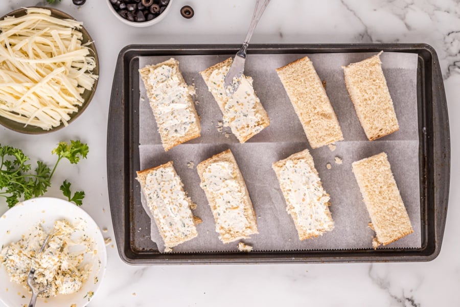 spreading butter mixture on bread slices