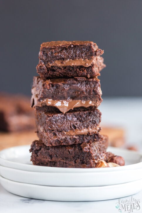 Nutella Stuffed Brownies stacked on a plate