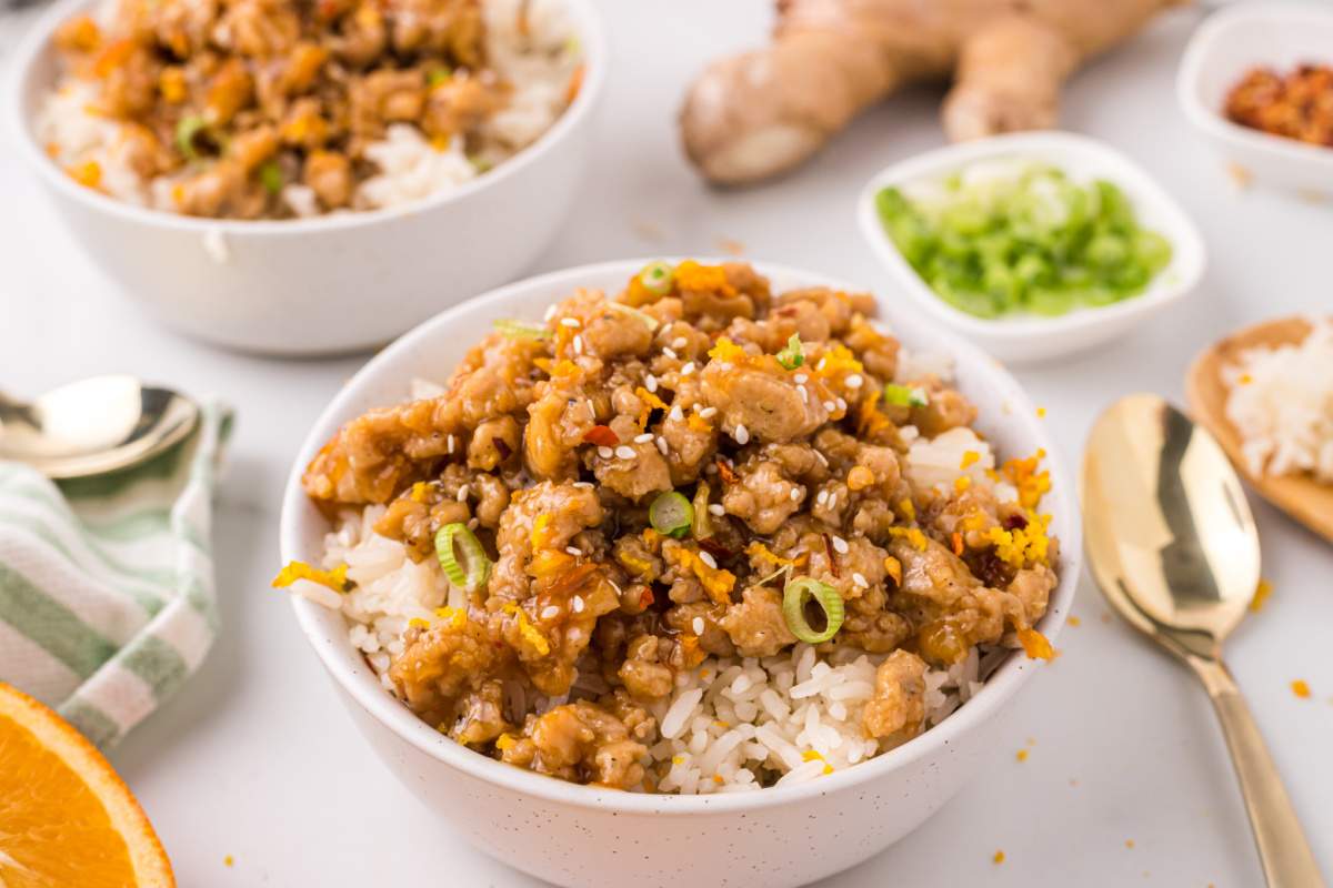 Orange Ground Chicken in bowls with rice