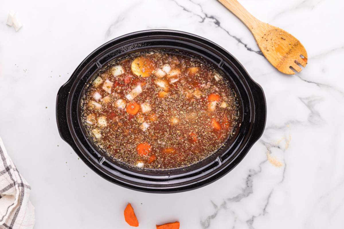 beef broth, Worcestershire sauce, garlic powder, Italian seasoning, onion powder, salt and pepper added to slow cooker