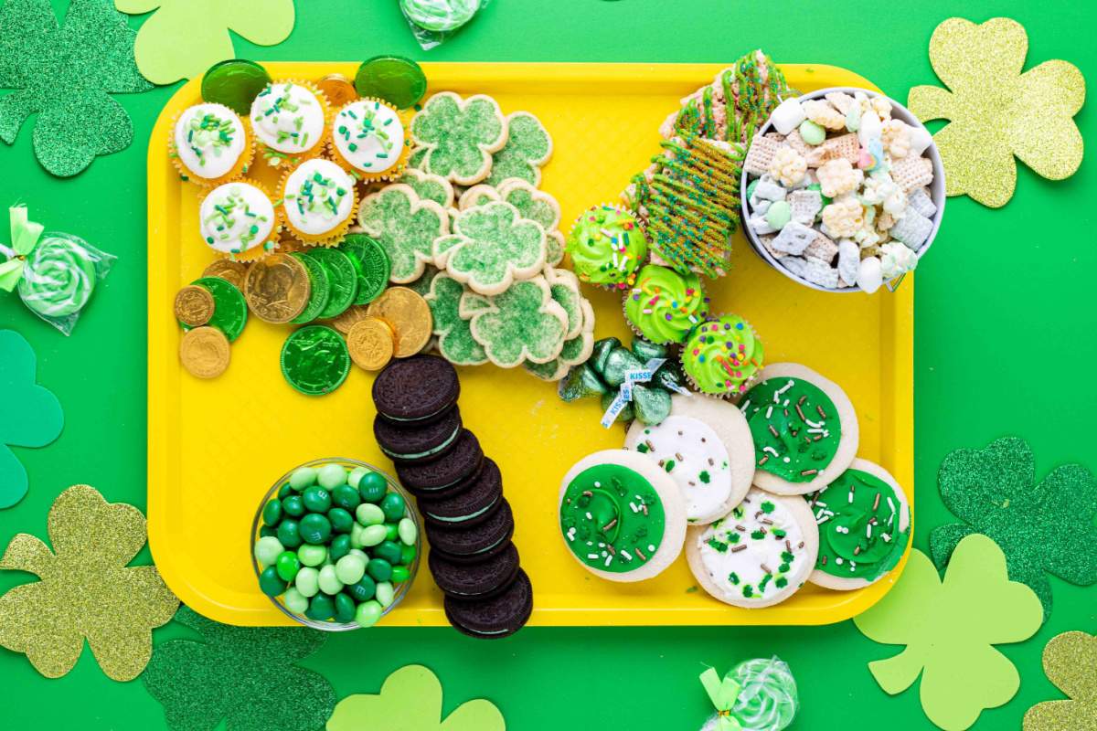 cookie and green colored candies added to tray