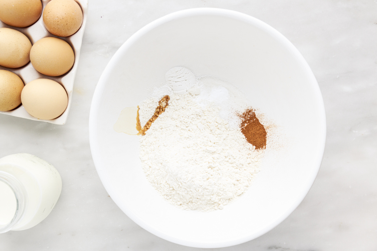 flour, sugar, baking soda, baking powder, salt and cinnamon in a bowl