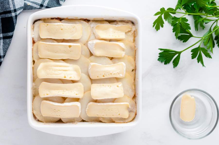 brie slices added to top of potatoes