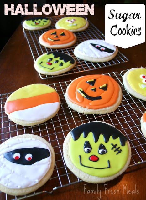 Halloween decorated sugar cookies on a cooling rack