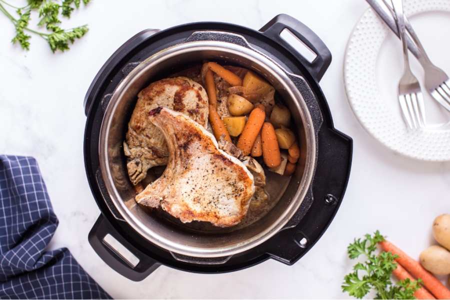 top down image of cooked pork chops and vegetables